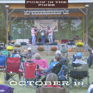 group on lawn watching bluegrass band